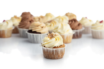 Frosted carrot cupcake in a close-up.