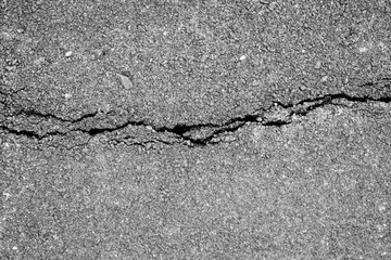 Obraz premium Close-Up texture of damaged asphalt road surface