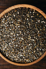 Chia seeds in a wooden bowl, closeup