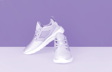 Shot of sneakers on lilac background.