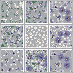 vector seamless pattern with violet leaves, violaceous flowers and small white simple flowers on a gray background
