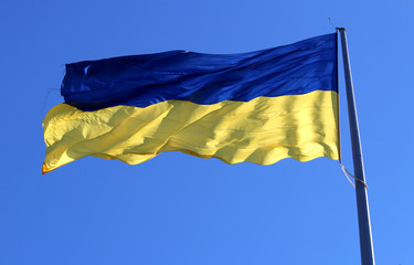 Yellow-blue national flag of Ukraine waving on the wind.