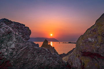 sunset in rocky beach 