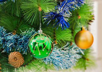Christmas tree decoration bauble and tinsel  background.