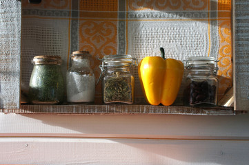 Fototapeta na wymiar Shelf with spices in jars. Beans, pepper, salt