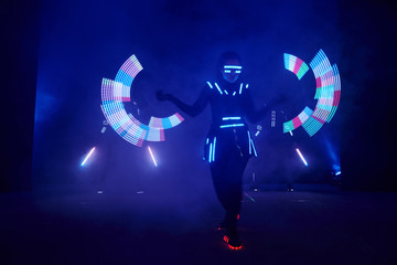 Laser show performance, dancers in led suits with LED lamp, very beautiful night club performance,...