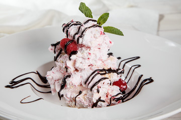 Raspberry pavlova desserts / Sweet meringue delicious dessert with raspberry cream
