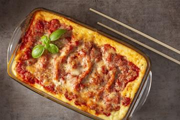 Baked cannelloni stuffed with with bolognese / ragu sauce and bechamel