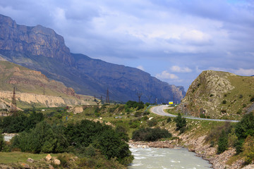 Fototapeta na wymiar Mountain river with a rapid flow in the Caucasus Range.