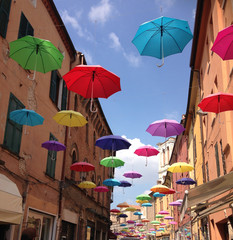 Fototapeta na wymiar Colorful umbrellas floating in the air
