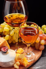 Wine and cheese on the table