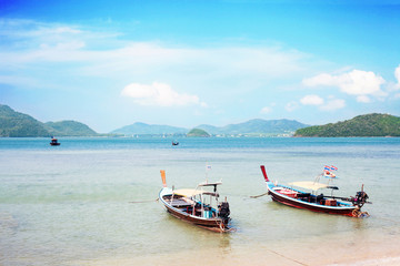 Naklejka na ściany i meble Old wooden boats in Andaman sea near shore, sunny light day