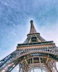 Upward view of Eiffel Tower on a beautiful sunny winter day - Pa