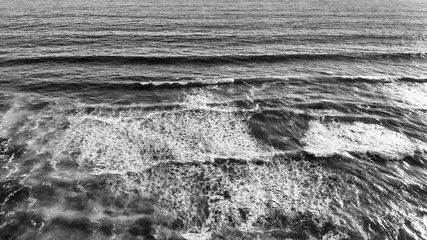 Ocean waves overhead aerial view on a sunny day
