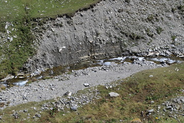 Mountain river into a deep ravine
