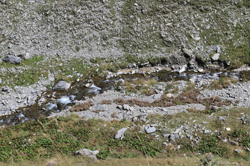 Mountain river into a deep ravine