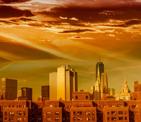 Old and modern buildings of big city at sunset