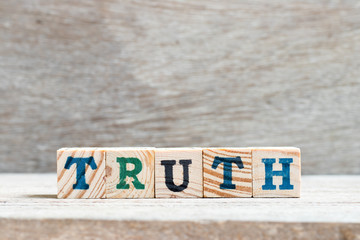 Letter block in word truth on wood background