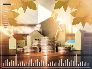 Mortgage concept by money house from the coins.