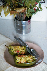 Autumn food with fresh vegetables, quick lunch: eggplant stuffed with tomatoes and cheese. The concept of healthy and vegetarian food.