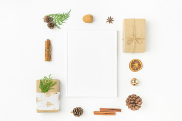 White Christmas frame mockup. Gift boxes in craft paper tied with twine fabric ribbon pine cones juniper nuts cinnamon. New Year presents holiday preparations DIY. Minimalist poster banner