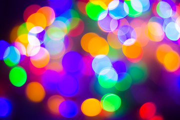 Defocused abstract multicolored bokeh lights background. Blue, purple, green, orange colors. - christmas and new year concept