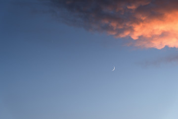 Obraz na płótnie Canvas Sunset sky. Moon and clouds