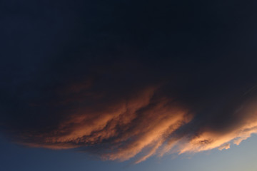 Night sky. Gloomy clouds. Fantasy