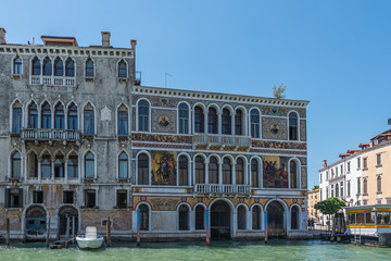 Naklejka premium VENICE, ITALY - JUNE 16, 2018: View of the building in the Canal Grande. Copy space for text.