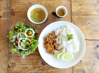 Salad and fried pork with rice and soup.