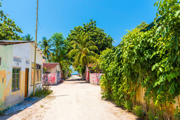 One of the central streets of small tropical island  Hangnaameedhoo, overlooking the Indies ocean, Maledives. Copy space for text.
