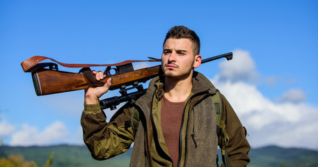Guy hunting nature environment. Masculine hobby activity. Hunting season. Hunting weapon gun or rifle. Man hunter carry rifle nature background. Experience and practice lends success hunting