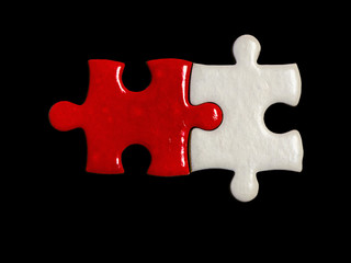 Fototapeta premium red jigsaw puzzle and white jigsaw puzzle on black background