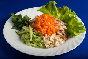 Salad of meat carrots cucumber