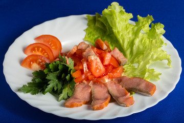 Smoked salmon fillet with chopped tomatoes