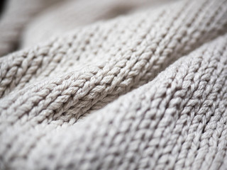 Closeup of folds of grey knitted fabric