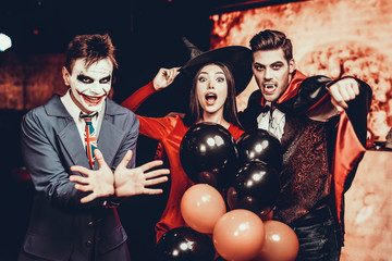 Young People in Costumes Celebrating Halloween