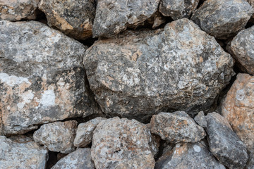 Seamless ashlar old Grey stone wall texture background. Horizontal