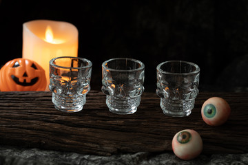 halloween spooky drink with candle eye ball pumpkin