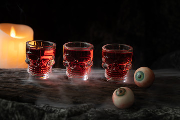halloween spooky drink with candle eye ball pumpkin