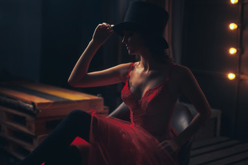 beautiful woman portrait in red dress and a hat