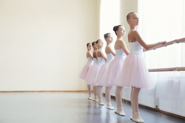 Ballet girls training before performance at dance class