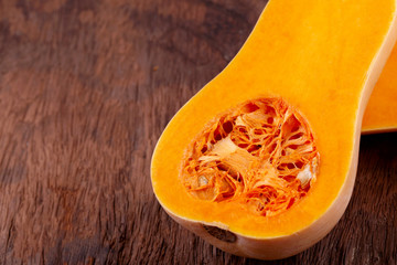 butternut squash over old wood background