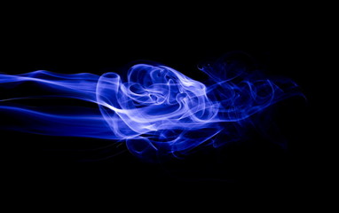 Fototapeta premium Blue smoke on black background