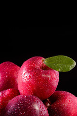 Red apples with leaves on the table