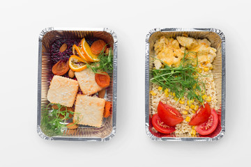 Set of take away difhes in black containers