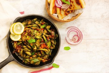 Hmemade Punjabi Bhindi Masala / Okra fry served with Paratha top view