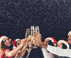 Champagne glasses in people hands at New Year