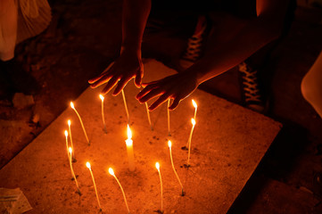 Candles. Witchcraft hands dark