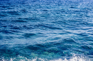 Blue sea water and small waves